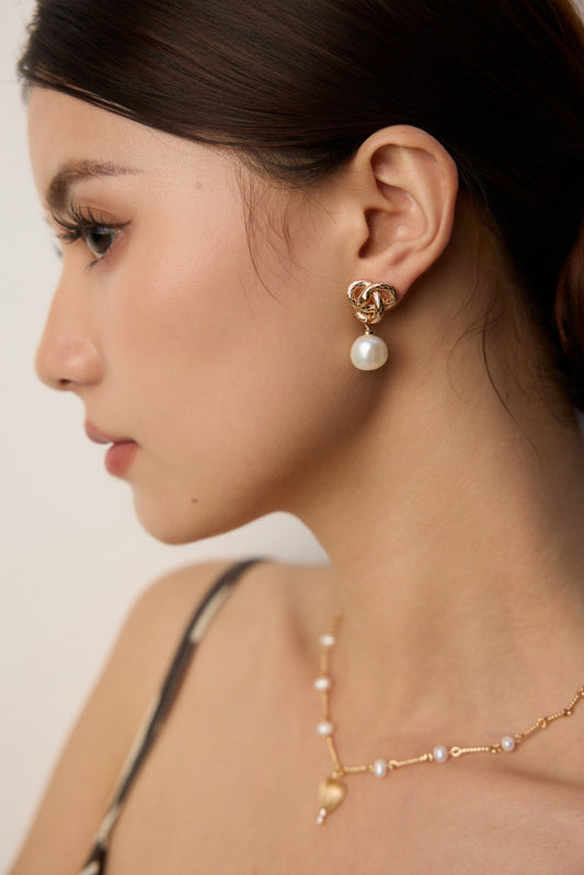 Golden Snake Coiling Around a Pearl