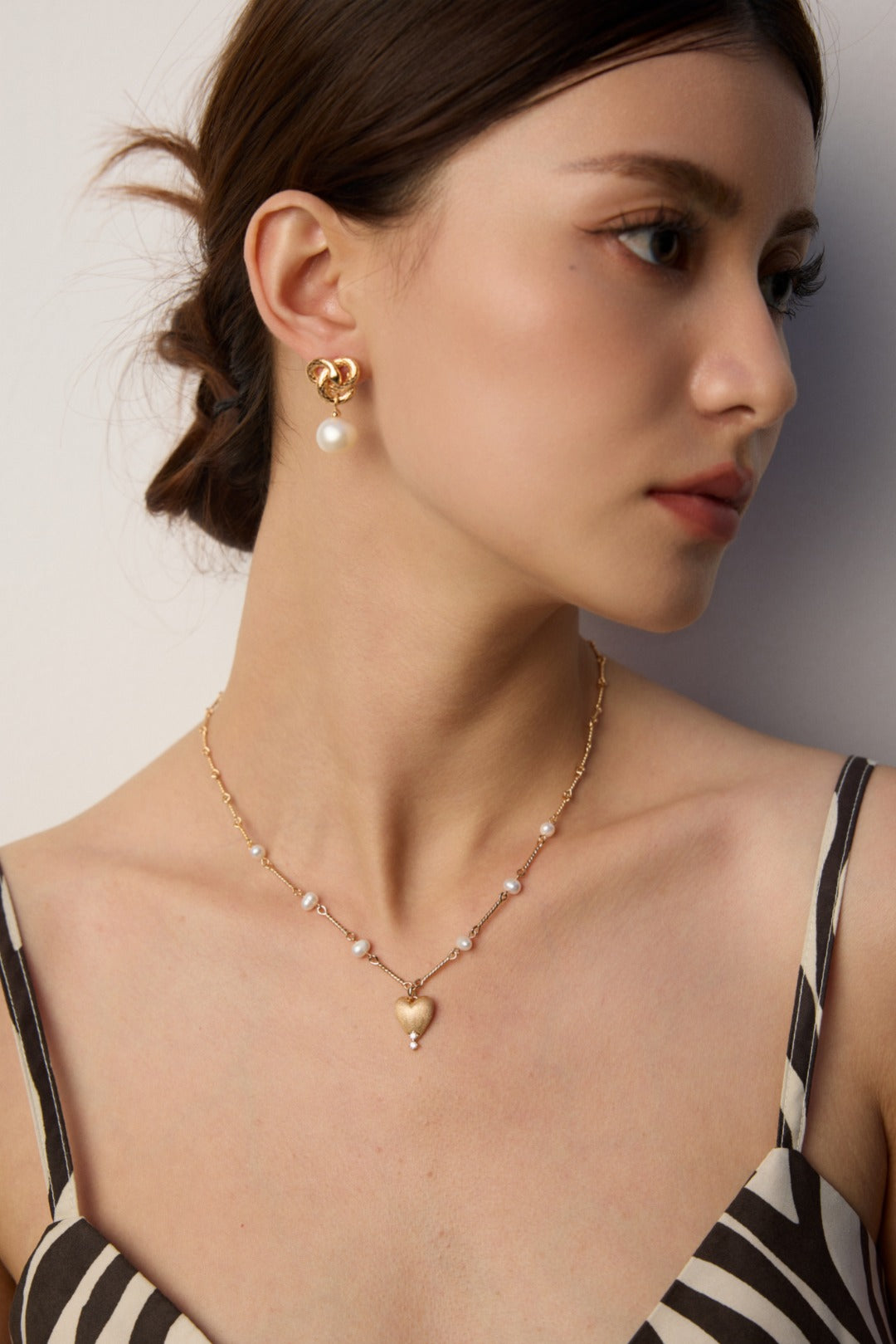 Golden Snake Coiling Around a Pearl