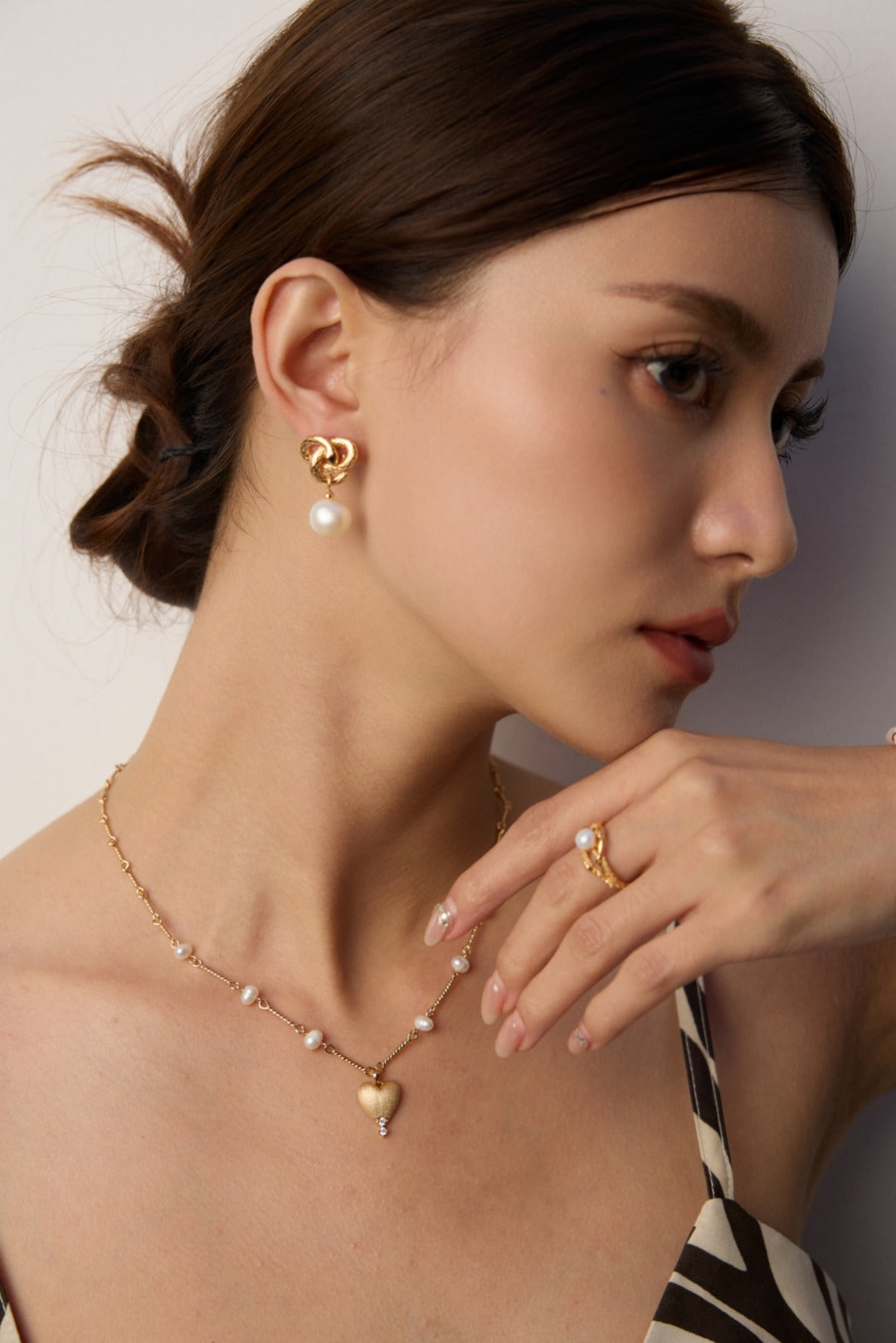 Golden Snake Coiling Around a Pearl